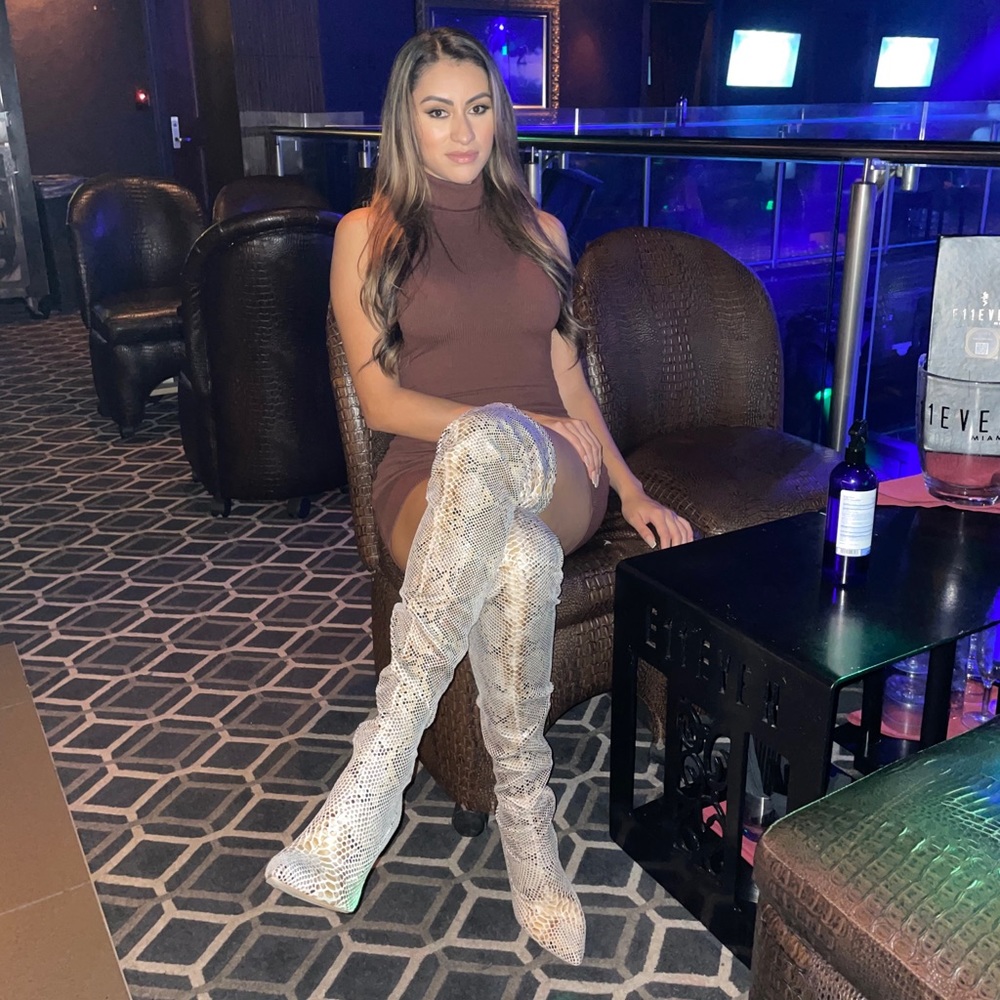 Snake print knee high boots